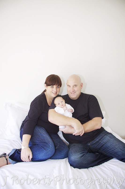 Family of 3, parents with baby in their arms - baby portraits sydney